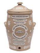 A pale brown stoneware 'Atkins Patent Safety Water Filter' and cover: by The Atkins Filter and