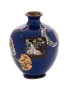 A Japanese cloisonne vase: of ovoid form with panels of exotic birds, flowers and butterflies,