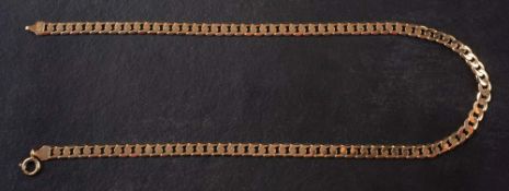 A 9ct. gold flattened curb-link necklace,: stamped '9KT', length ca. 45cm, total weight ca. 19.4gms.