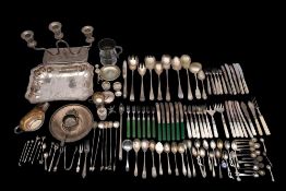 A collection of assorted silver plated wares: includes candelabra, serving dish, gravy boat,