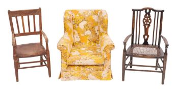 An Edwardian upholstered child's wing armchair, early 20th century, with outscrolled arms,