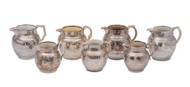 A group of seven early 19th century Staffordshire silver lustre pottery jugs: resist decorated with