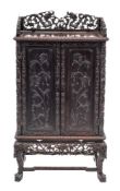 A Chinese carved and ebonised hardwood side cabinet, 19th century,