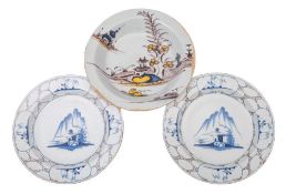 An English polychrome delftware basin and a pair of dishes: the basin painted with a Chinese