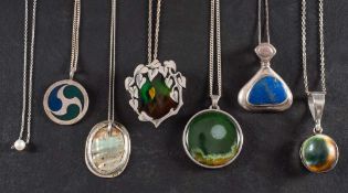 Seven gemset pendants,: including a silver pendant set with abalone shell, maker's mark, 'IM',
