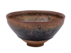 A Chinese Henan black-glazed 'hare's fur' bowl: the rim and foot unglazed, probably Song dynasty,