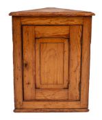 A George III pine hanging corner cupboard, late 18th century,