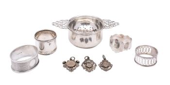 An Elizabeth II silver tea strainer and stand, maker Harrods, Sheffield,