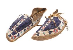 A pair of 19th century Native North American moccasins: buckskin with applied geometric pattern