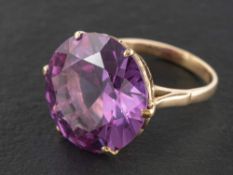 A synthetic colour-change sapphire,: stamped '9CT', length of ring head ca. 1.