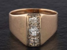 A round, brilliant-cut diamond three-stone ring,: total estimated diamond weight ca. 0.