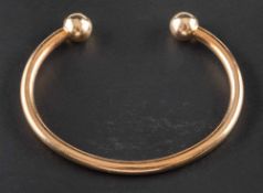 A 9ct gold bangle,: with partial hallmarks for Sheffield, inner diameter ca. 6.5cm, total weight ca.