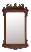 A walnut framed wall mirror in Queen Anne taste, 19th century,: with fret cut cresting,