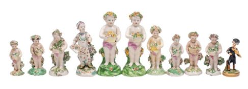 A group of ten Derby figures of putti and a similar figure of Dr.