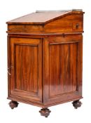 A goncalo alves Davenport in Regency style,: the top with brass three quarter gallery,