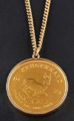 A Krugerrand gold coin pendant,: the coin dated 1974, the mount 9ct gold,