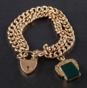 A double-row, curb-link bracelet with heart-shaped clasp and Victorian jasper and carnelian fob,