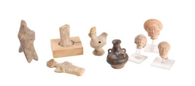 Three Roman pottery bust fragments: together with a Greek hollow cast figure and three other items.