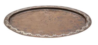An Arts and Crafts period copper tea tray: of oval outline, with silvered scalloped designed border,