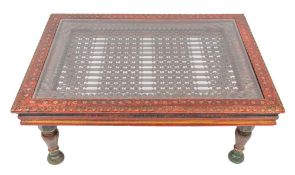 An Indian carved and painted wood and wrought iron mounted low table, 20th century,