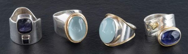 Four gemset rings,: including aquamarine, amethyst, light green chalcedony and sapphire,