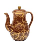 A Rockingham treacle-glazed earthenware baluster teapot and cover: decorated in gilt with a