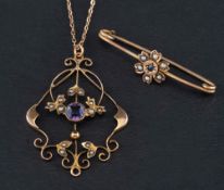 A brooch and a pendant,: an openwork, imitation seed pearl and purple paste pendant, stamped 9ct,