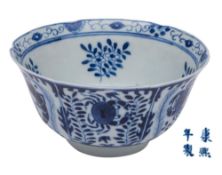 A Chinese blue and white bowl: with lobed rim, painted overall with fish and crustaceans,