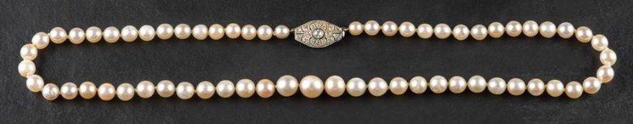A graduated, cultured pearl necklace with single-cut diamond clasp,