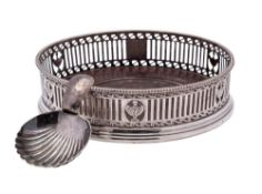 A George III silver wine coaster, maker's mark worn, London, 1778: with pierced gallery,