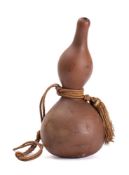 A double gourd water container: of natural form, 34cm high.