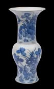 A Chinese blue and white 'lotus pond' yen yen vase: the trumpet neck and baluster body painted with