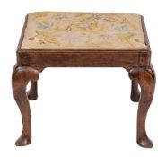 A walnut and upholstered stool, circa 1730,
