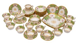 A Coalport part tea service: painted and printed with floral sprays reserved on a gilt and apple