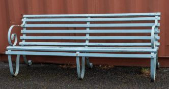 A wrought iron and slatted wood garden bench, early 20th century,