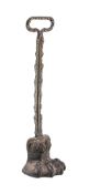 A 19th century cast iron and bronze door stop: in the form of a lion's paw,
