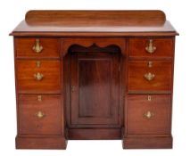 A Victorian mahogany kneehole desk in George II style, last quarter 19th century,