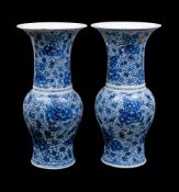 A pair of Chinese blue and white yen yen vases: each painted overall with large peony blooms and
