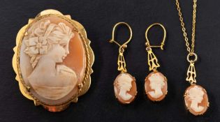 A cameo shell brooch, pendant and pair of earrings,: all depicting a lady in profile, the pendant,