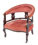 An Edwardian ebonised and upholstered tub elbow chair, early 20th century,