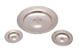 An Elizabeth II matched set of three silver graduated Armada plates, makers Heming & Co, London,