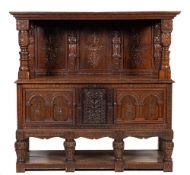 A carved oak court cupboard or duodarn, elements possibly early 17th century and later,