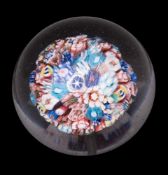 A Clichy close pack millefiori mushroom paperweight: set with an arrangement of pastry, star,