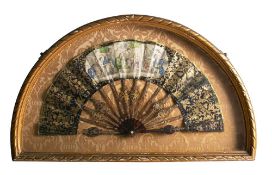 A mid 19th century tortoiseshell fan: the leaf with printed and hand coloured panel of