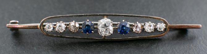 An old-cut diamond and cushion-cut sapphire, openwork brooch,