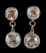 A pair of old-cut diamond, mille-grain-set, two-stone drop earrings,