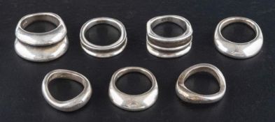 Seven modernist rings,: all rings stamped '950', two with maker's marks 'T'S', ring sizes M-P,