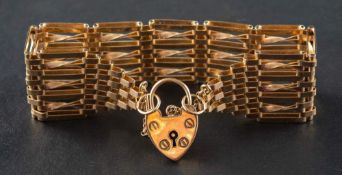 A 9ct gold, gate-link bracelet with heart-shaped clasp,: with hallmarks for London, 1968, length ca.