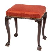 A mahogany and upholstered stool in George II style, circa 1900,