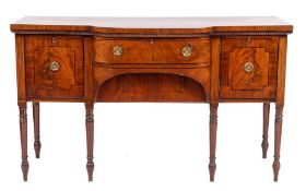 A Regency mahogany and ebony strung bowed breakfront sideboard, circa 1815,